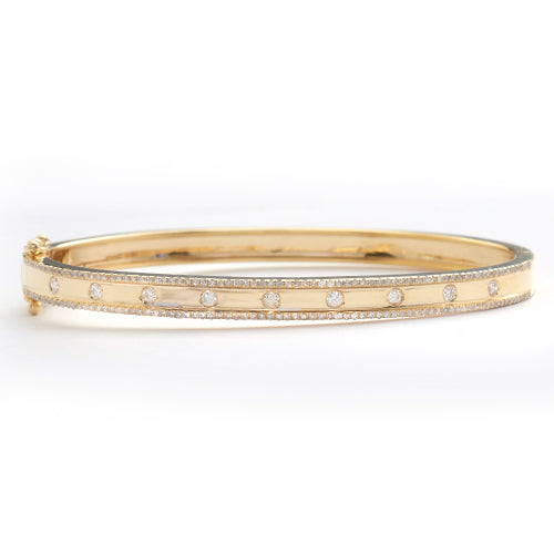 14KY 0.70CTW DIAMOND BANGLE - 9 STONE CENTER ROW